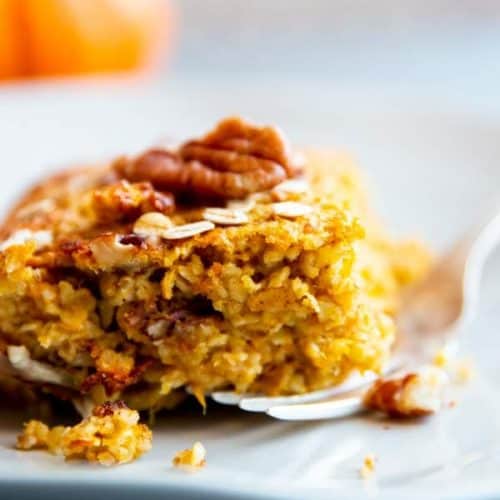 slice of pumpkin baked oatmeal on a white plate