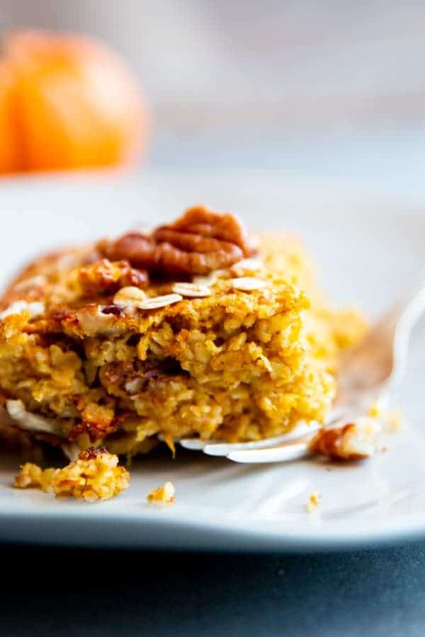 slice of pumpkin baked oatmeal on a white plate