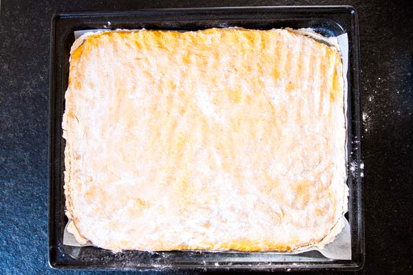 dough for pumpkin cinnamon rolls on a baking sheet
