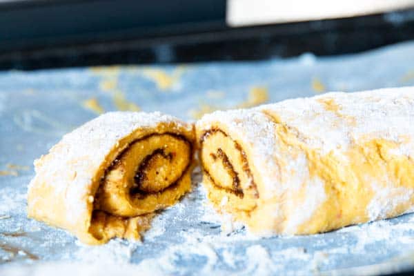 cutting pumpkin cinnamon rolls