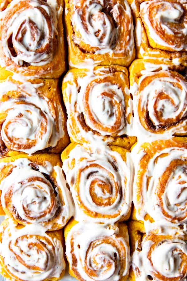 frosted pumpkin cinnamon rolls