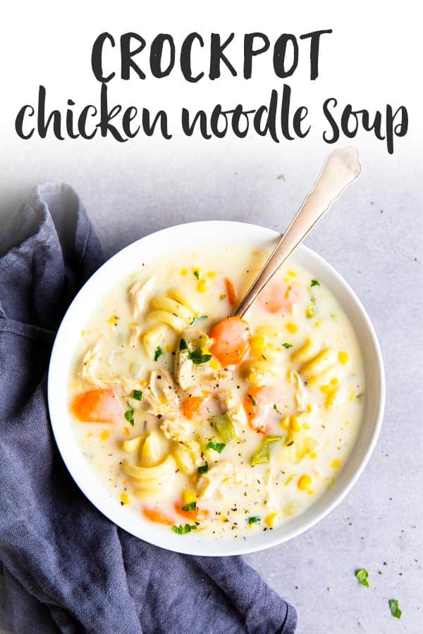 This Creamy Crockpot Chicken Noodle Soup is one of our favorite weeknight dinners! It cooks in your slow cooker all day to turn into a hearty, flavorful meal. | #healthy #healthyrecipes #healthyeating #healthyfood #crockpot #slowcooker #chickensoup #chickenrecipes #chicken #easydinner #easyrecipes #recipe white bowl with chicken noodle soup on the counter with a text overlay
