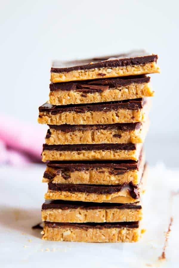 close up photo of a stack of chocolate peanut butter bars