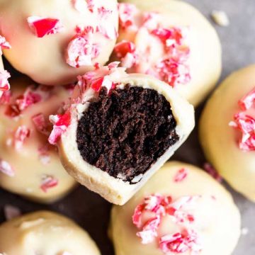 oreo ball with a bite taken out on top of other peppermint oreo balls