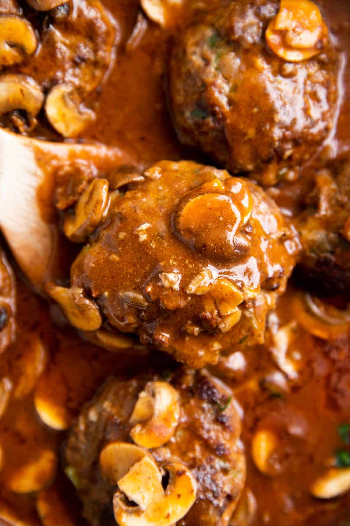 close up of Salisbury steak patty covered in gravy