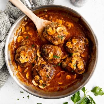 skillet with salisbury steak in mushroom gravy