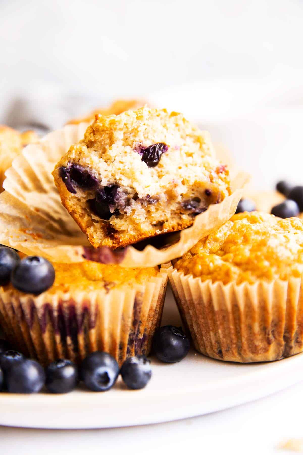 frontal view of blueberry oatmeal muffin broken in half