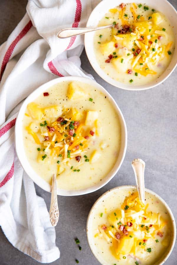 three bowls with instant pot potato soup