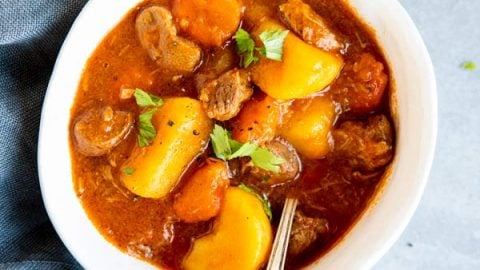 three white bowls with Irish stew