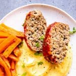 instant pot meatloaf on a plate with mashed potatoes and carrots