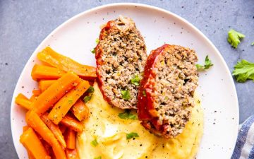 instant pot meatloaf on a plate with mashed potatoes and carrots