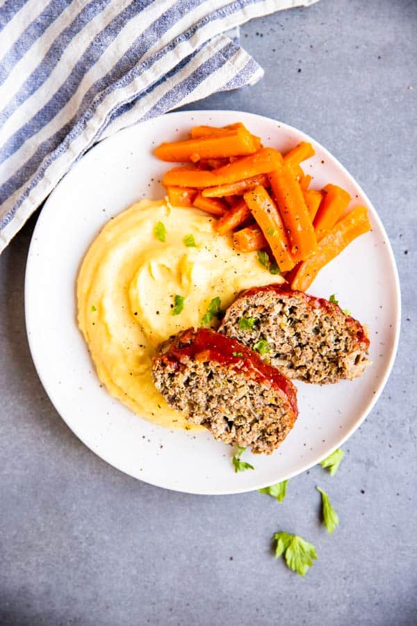 plate with mashed potatoes, carrots and meatloaf