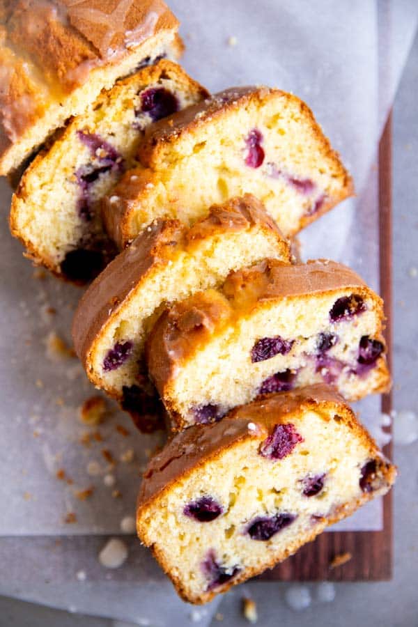 slices of lemon blueberry bread on a wooden board