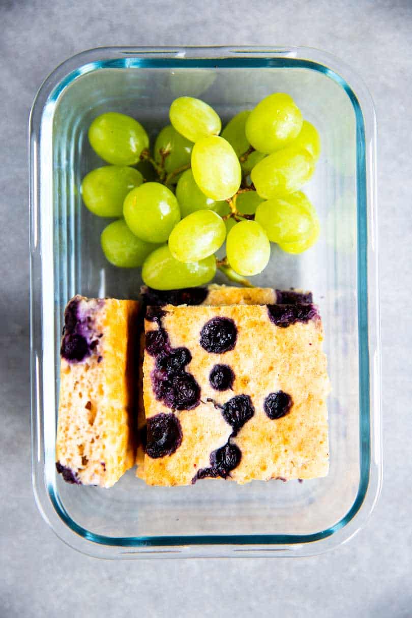 container with sheet pan blueberry pancakes and grapes