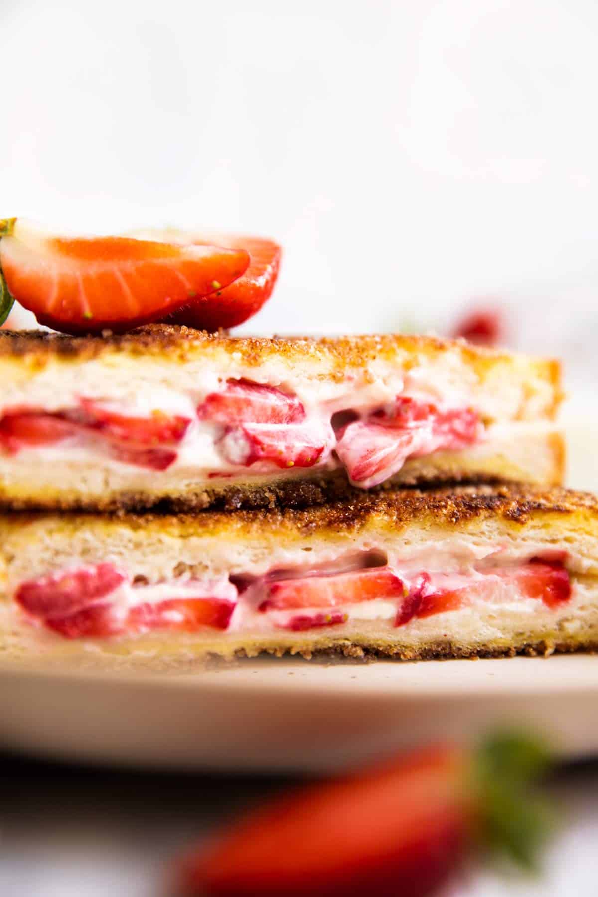 close up photo of strawberry filling in a stuffed French toast