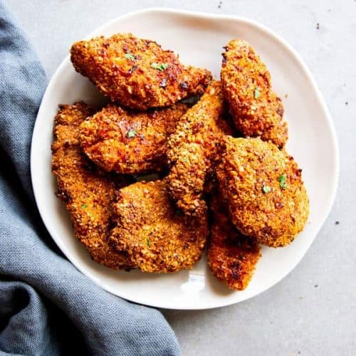 plate with pieces of cornmeal oven fried chicken