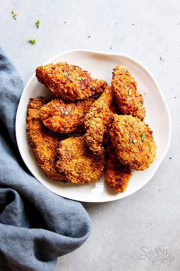 plate with pieces of cornmeal oven fried chicken