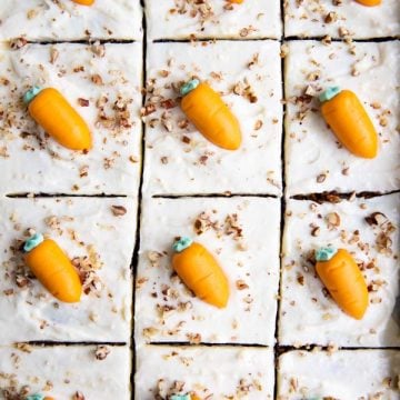 carrot sheet cake in the pan with frosting carrots