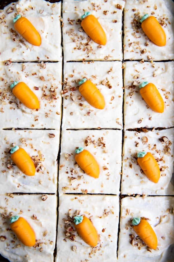 carrot sheet cake in the pan with frosting carrots