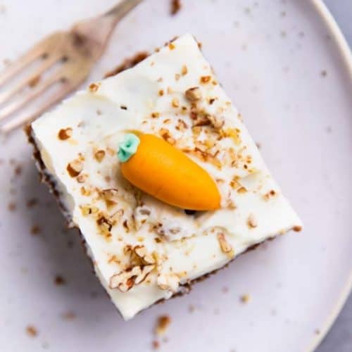 slice of carrot cake on a white plate