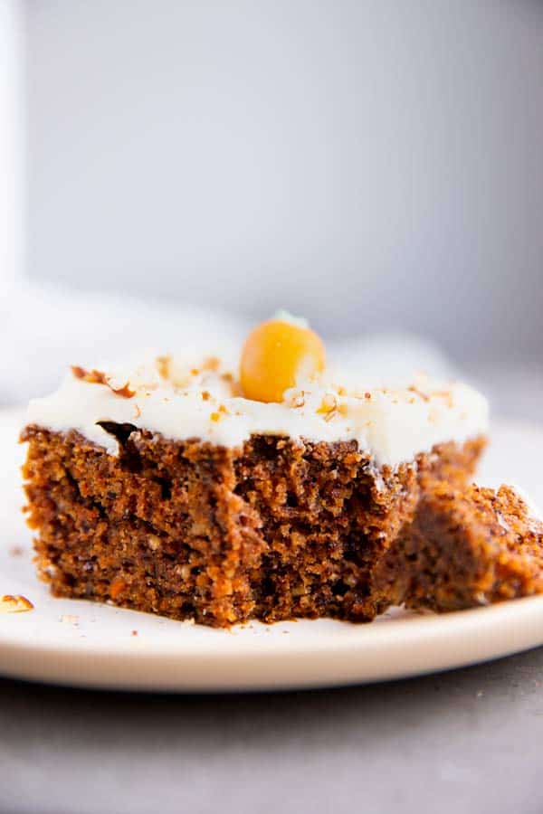 slice of carrot cake with a bite taken out
