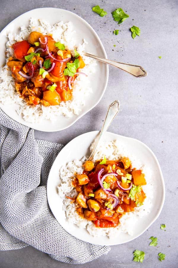 two plates with instant pot pineapple chicken and rice