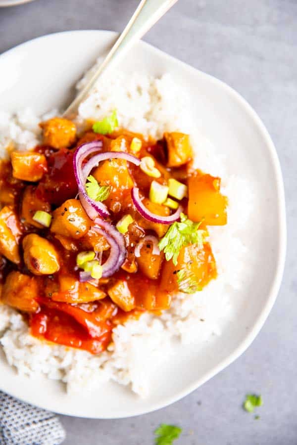 close up of instant pot pineapple chicken on a plate with rice