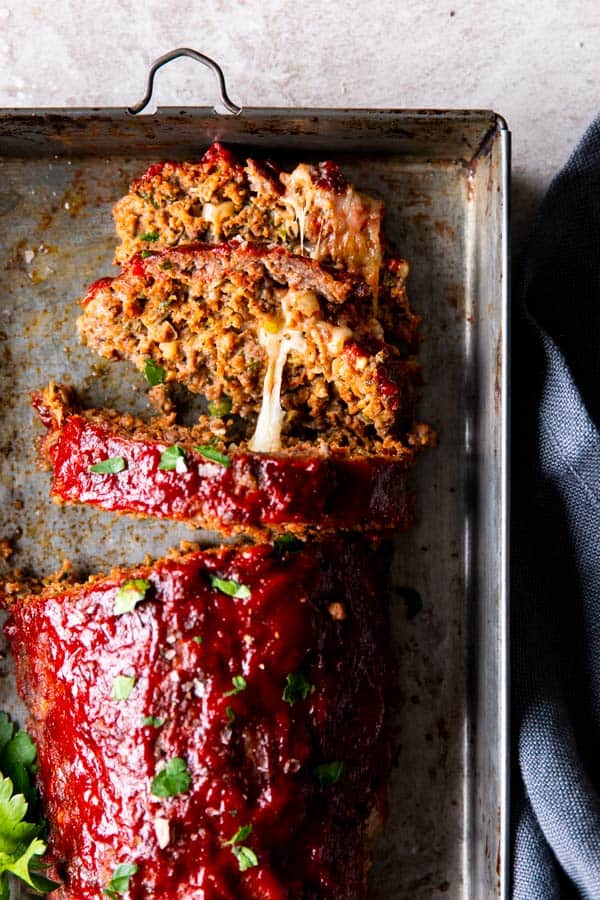 gooey cheese oozing out of a mozzarella stuffed meatloaf