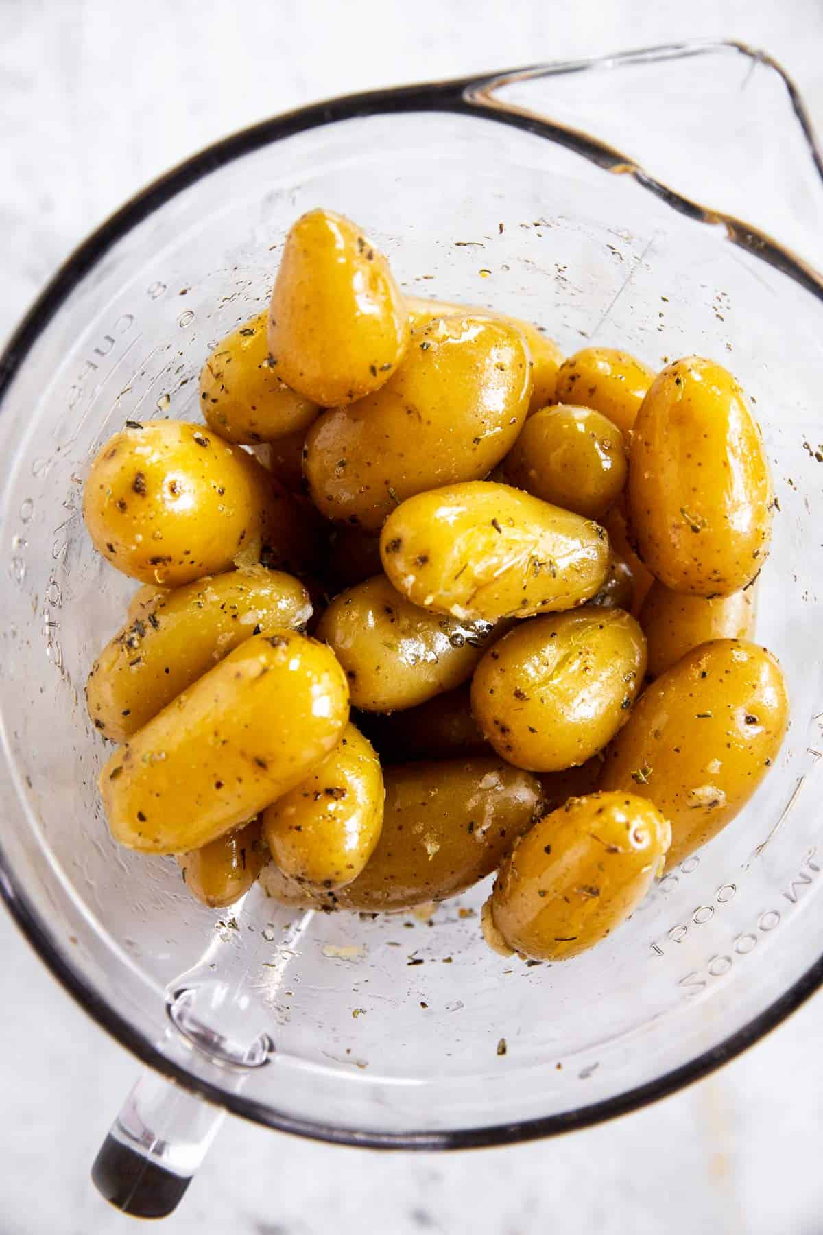 glass bowl with seasoned boiled potatoes