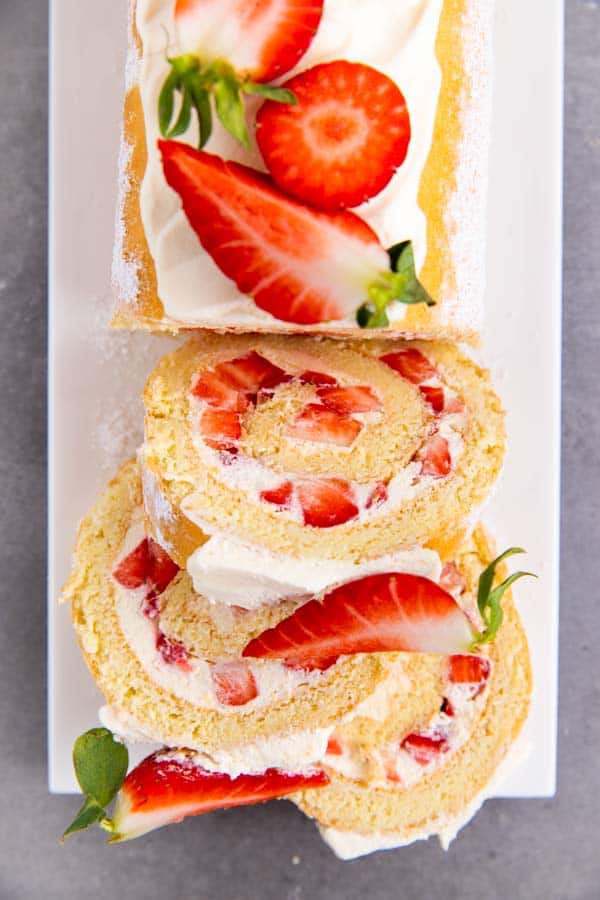 sliced strawberry cheesecake roll cake
