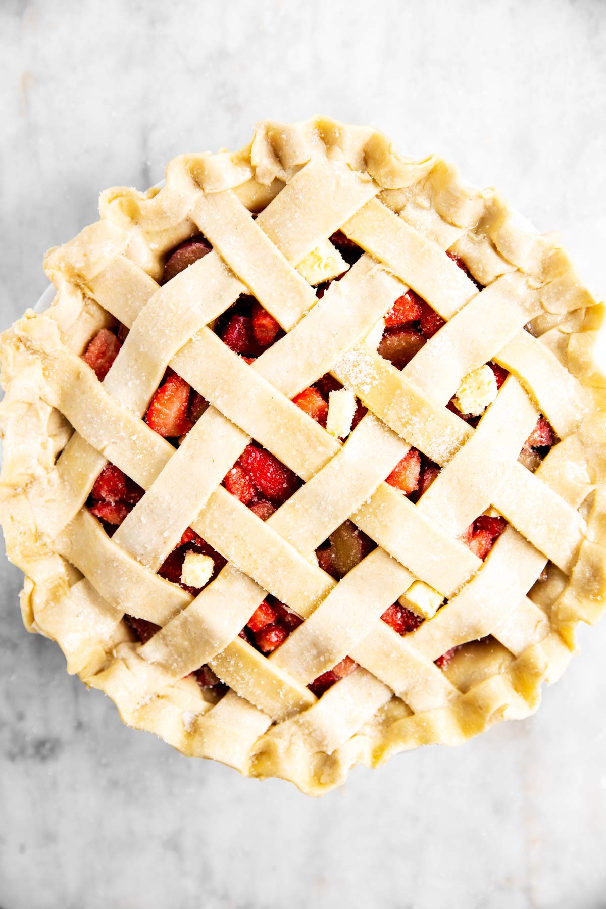 overhead view of unbaked strawberry rhubarb pie
