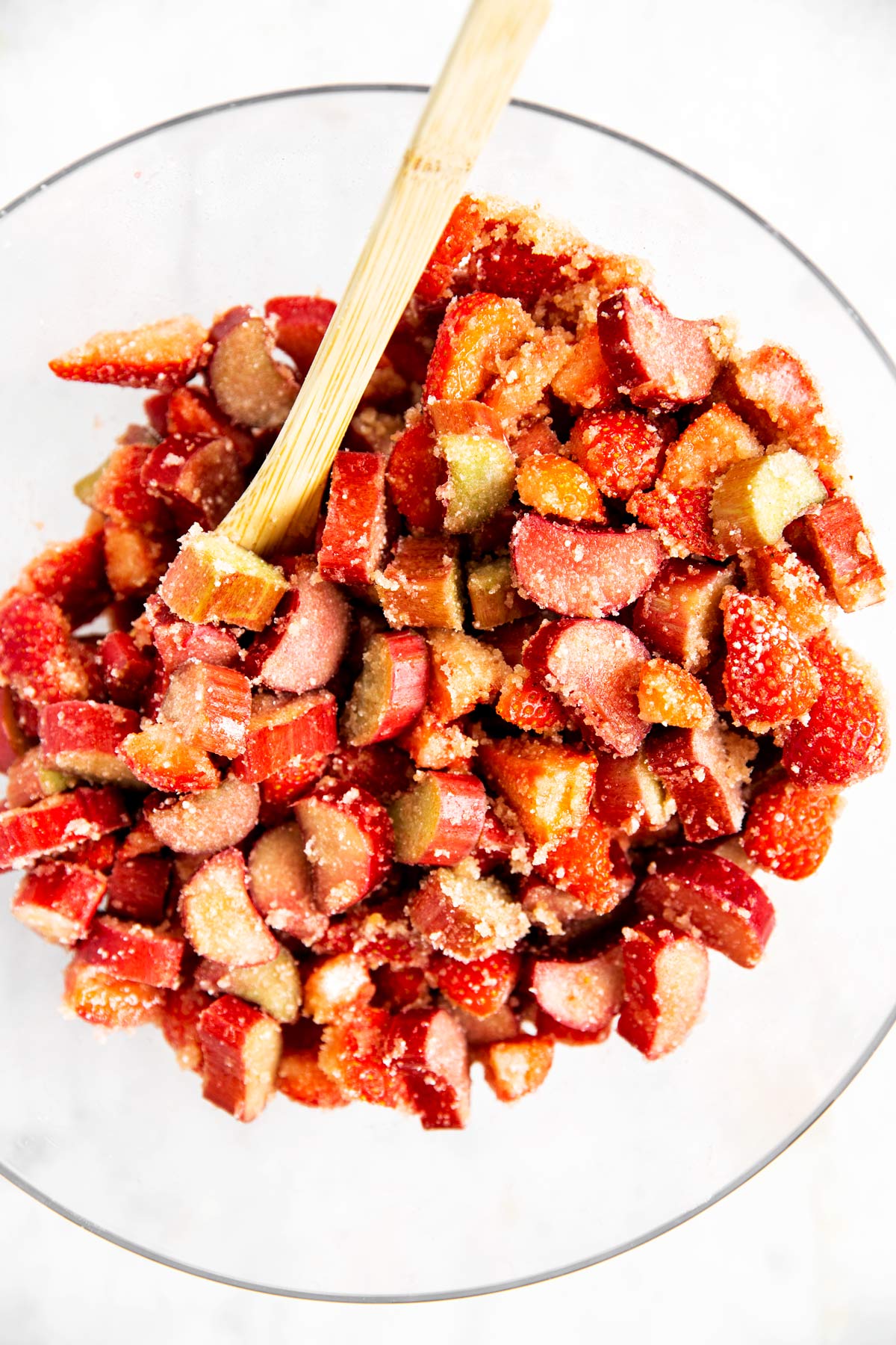 ingredients for strawberry rhubarb pie filling in glass bowl