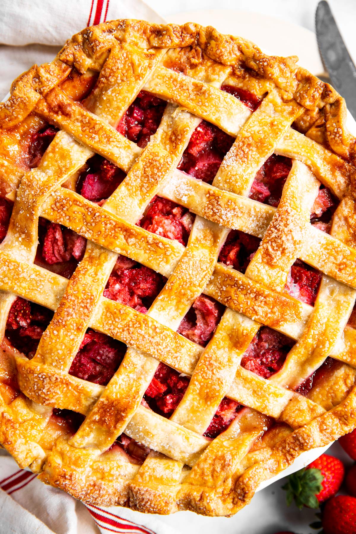 overhead close up view of baked strawberry rhubarb pie