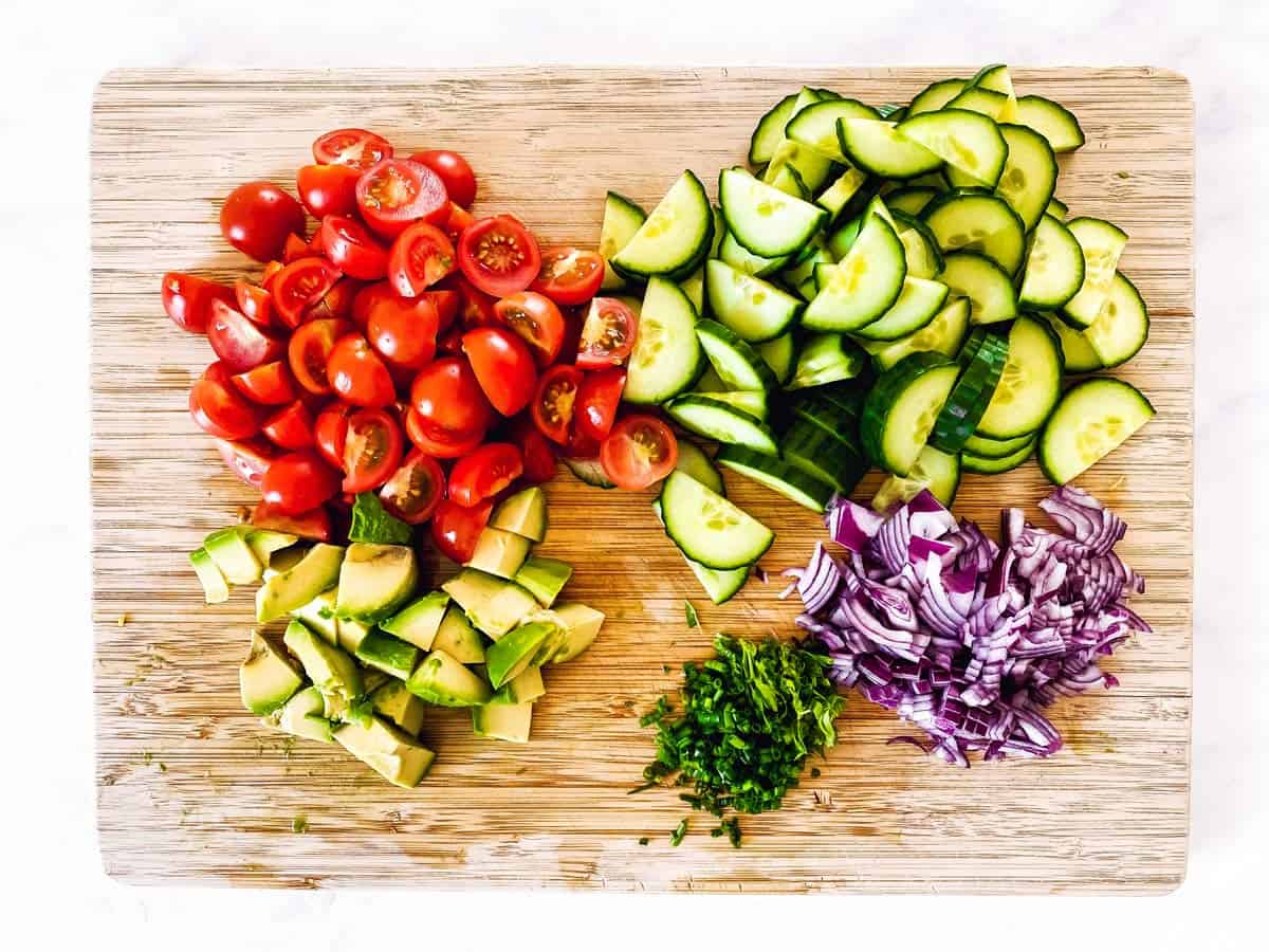 sliced vegetables on wooden chopping board