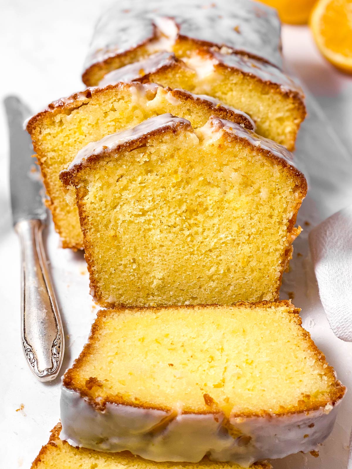 frontal view of sliced lemon loaf cake