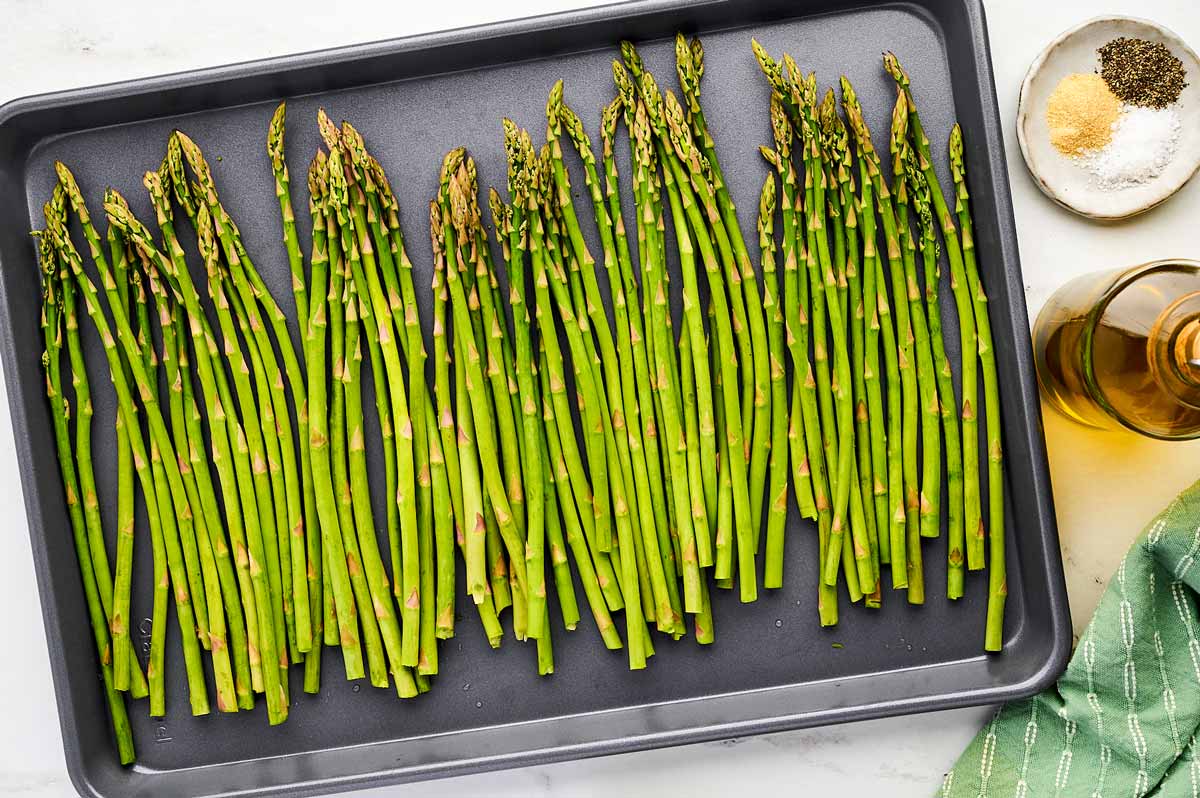 Unroasted asparagus on sheet pan.