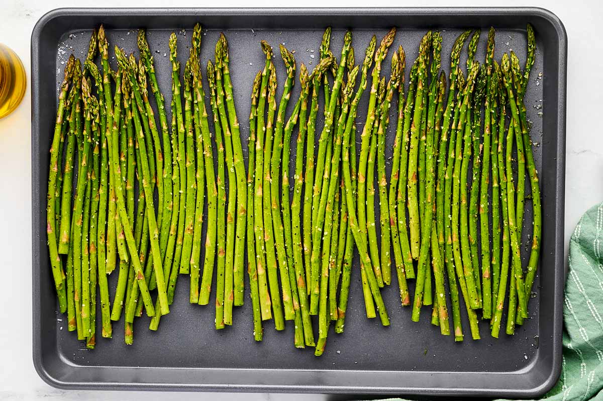 Roasted asparagus on a sheet pan.