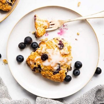 top down view on plate with blueberry scone and fork