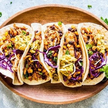 chicken tacos on wooden platter