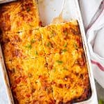 sliced hash brown breakfast casserole in a white dish