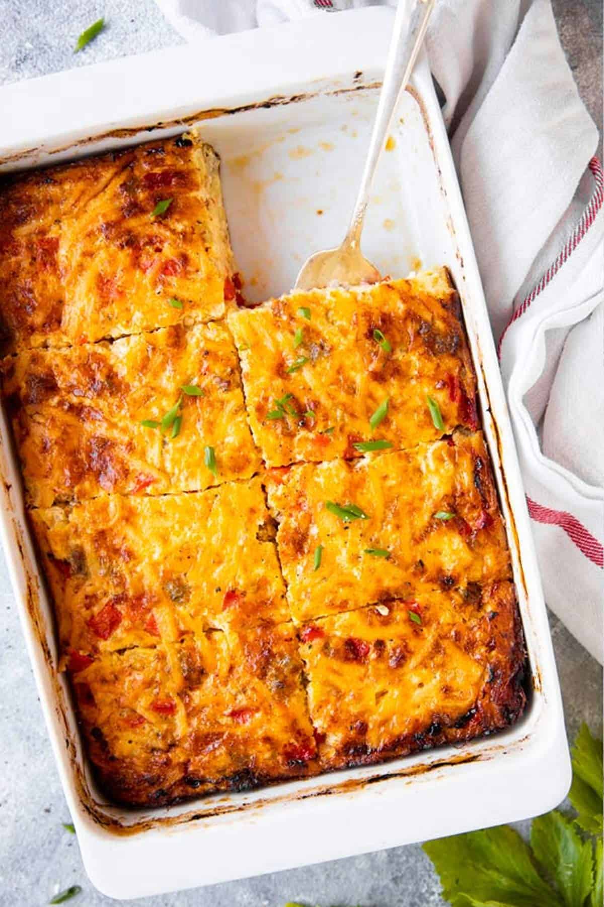 sliced hash brown breakfast casserole in a white dish