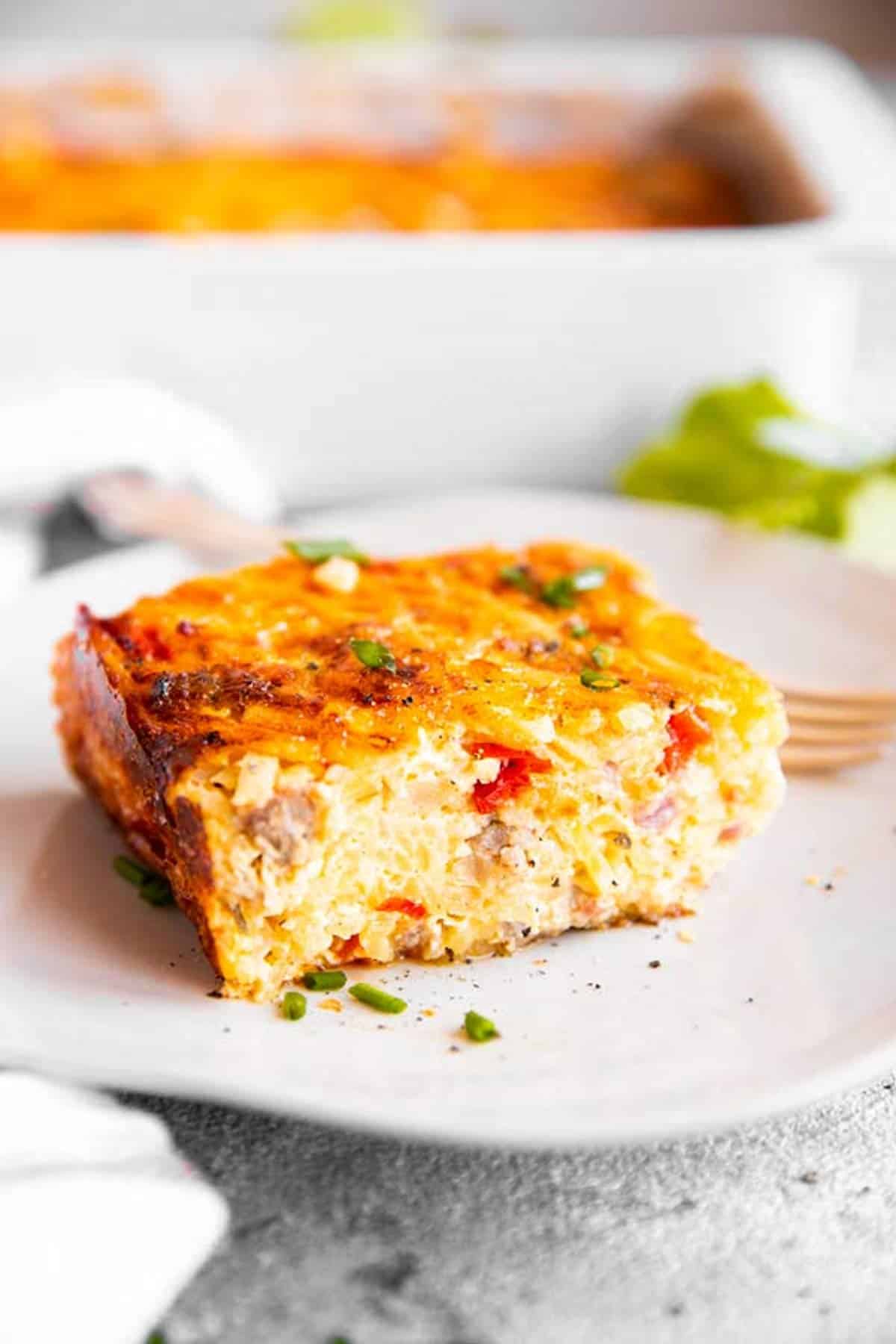 slice of hash brown breakfast casserole on white plate