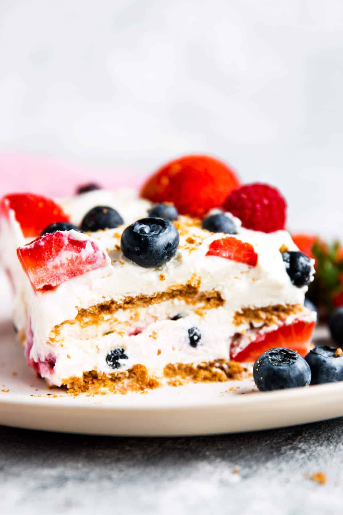 slice of icebox cake with berries on a white plate