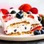 slice of icebox cake with berries on a white plate