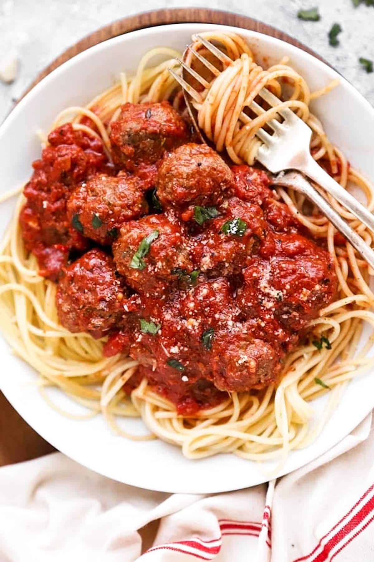 close up of plate with spaghetti and meatballs