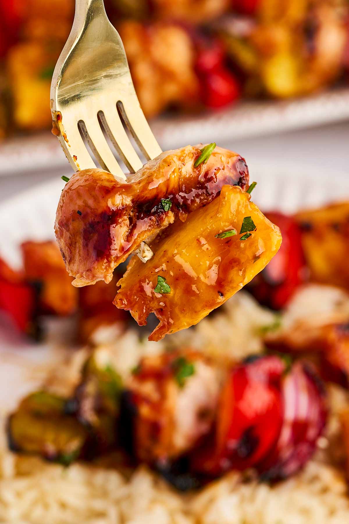 fork with chicken and pineapple