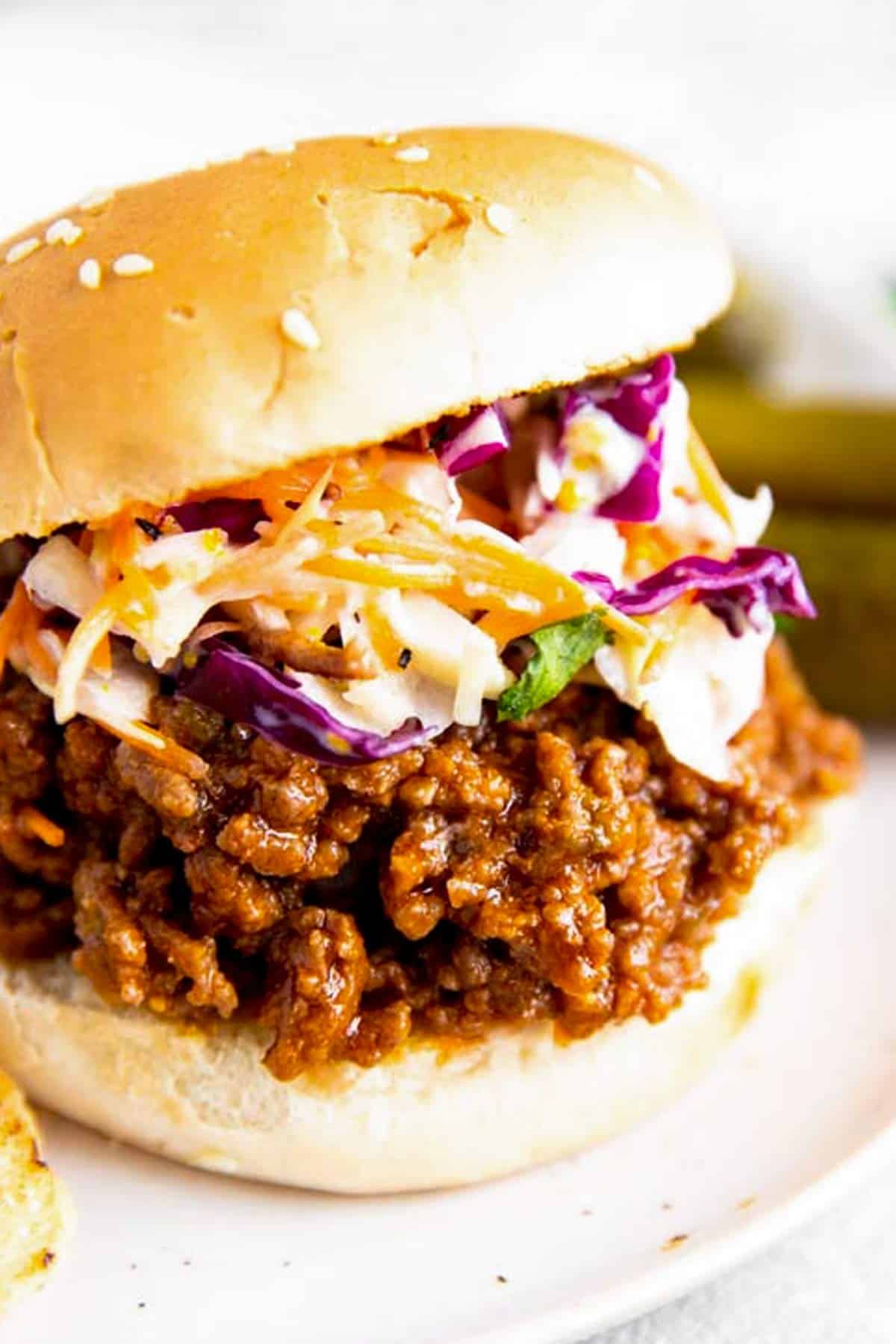 close up photo of sloppy Joe bun with coleslaw