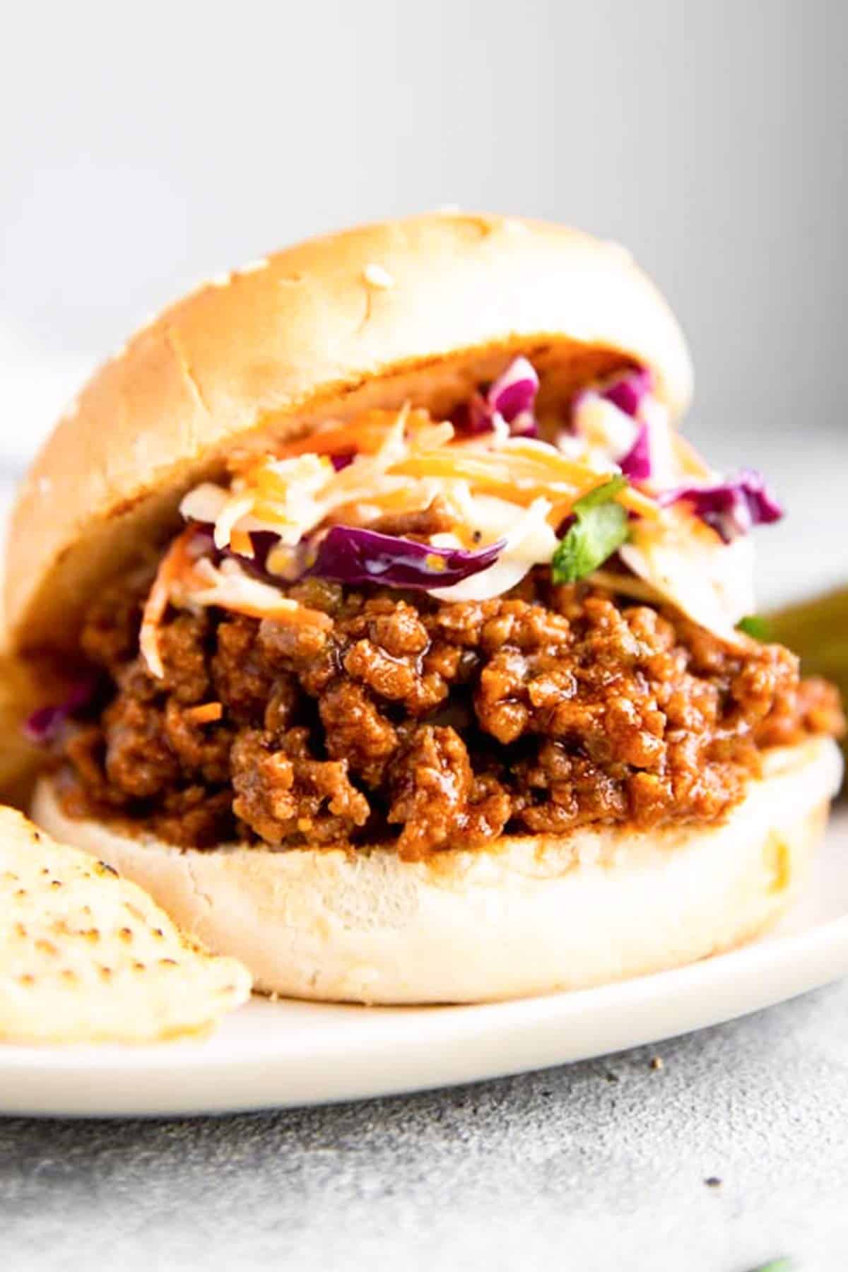 instant pot sloppy joes in bun on white plate