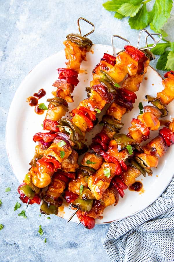 plate with pineapple bbq chicken kabobs