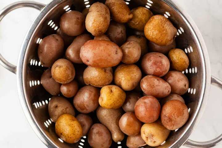 cooked baby potatoes in colander